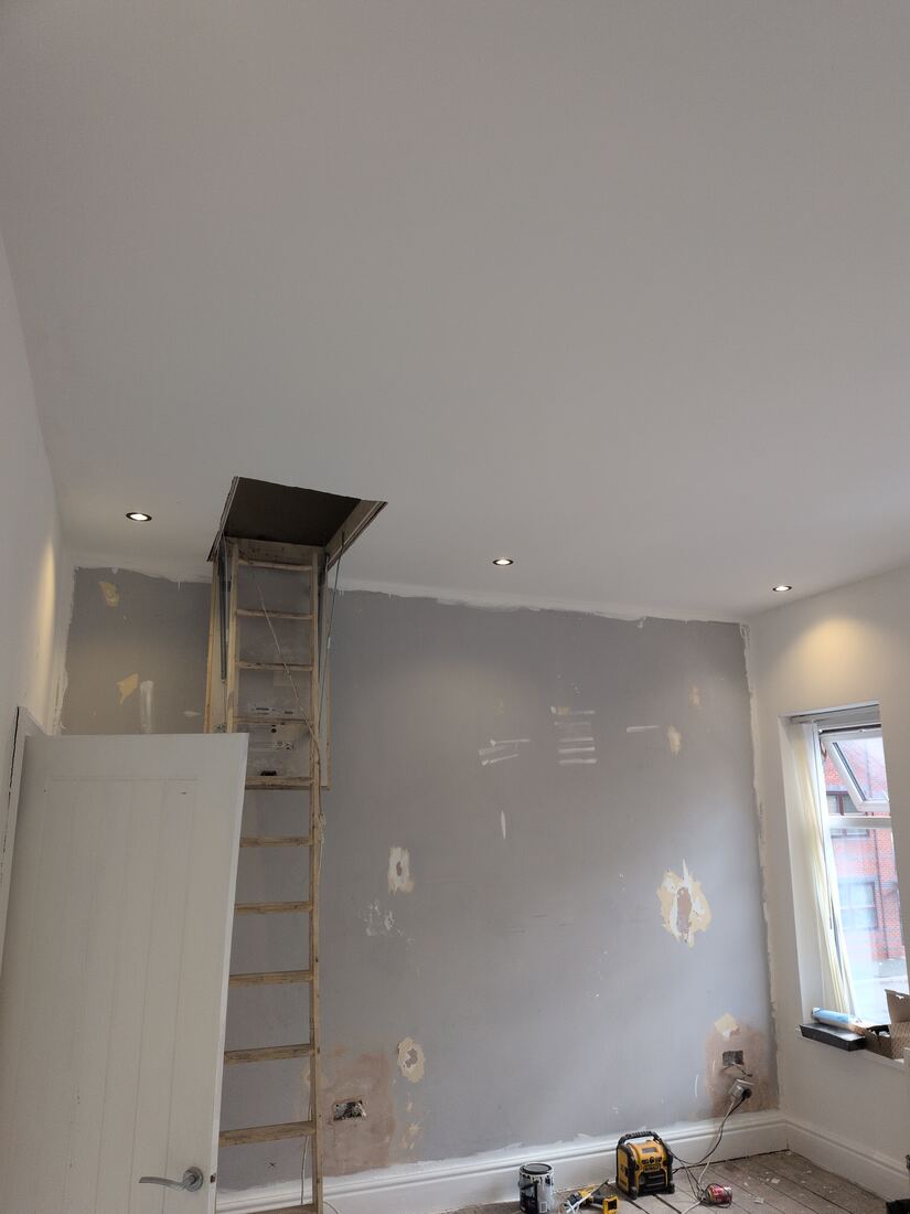 Finished room with LED downlights and loft access ladder